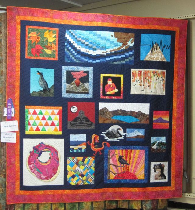 Retirement quild for Chris Nye. Most of the blocks have something to do with volcanoes, though a couple such as his portrait are more personal.